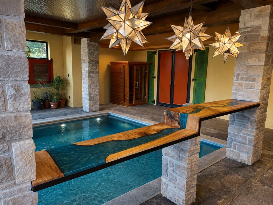 Black oak double miter waterfall epoxy river bartop