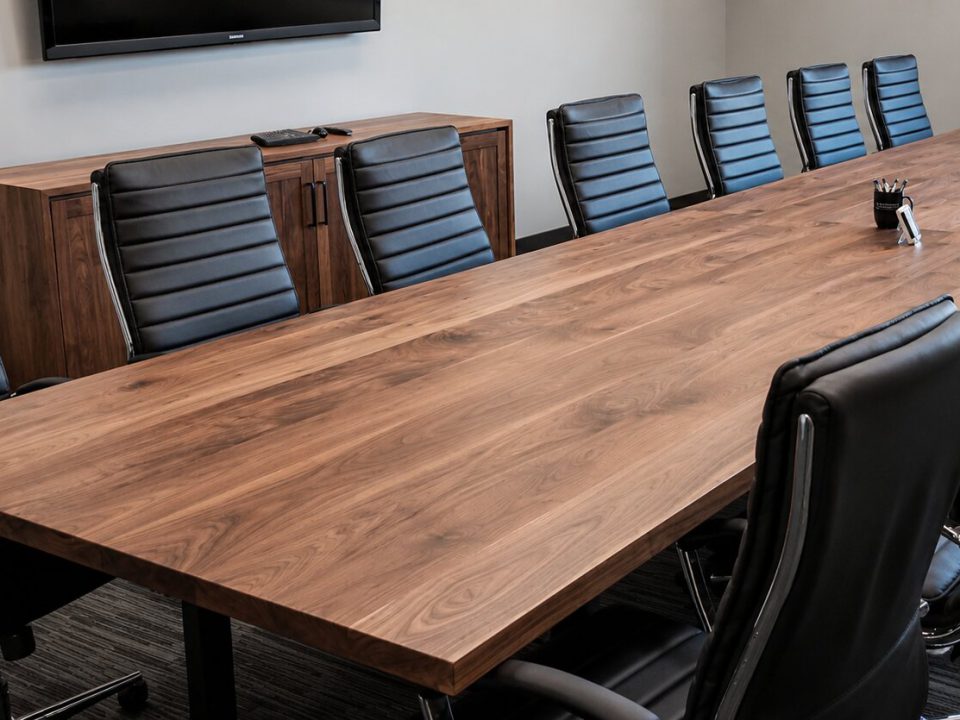 Steamed black walnut conference table with natural finish and random width lamination